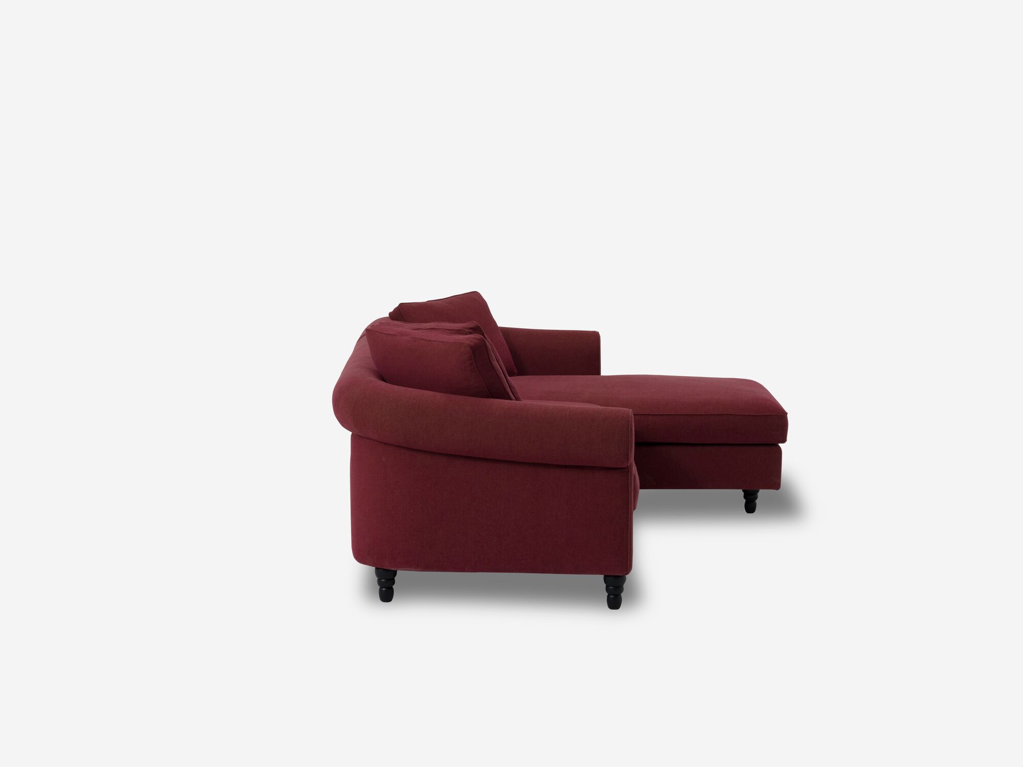 Side view of deep red modern right hand facing sectional sofa